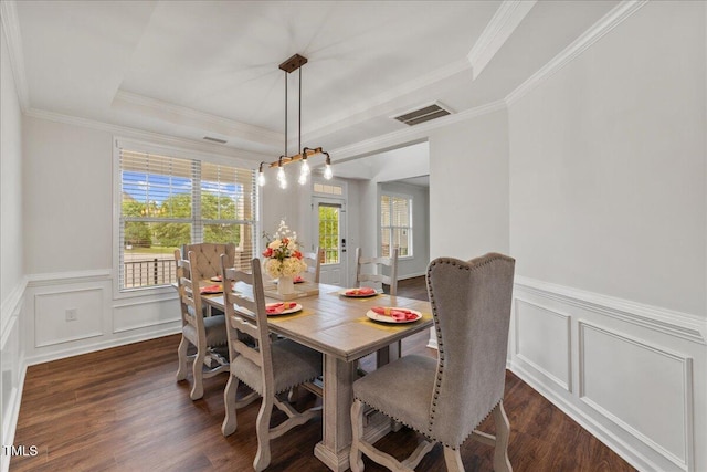 1704 Fawn Chase Ct, Wake Forest, NC 27587 - dining area with a tray ceiling, dark wood-type flooring, wainscoting, a decorative wall, and crown molding