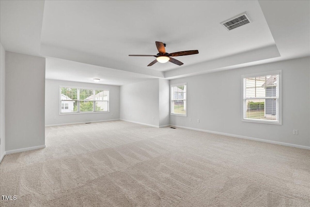 1704 Fawn Chase Ct, Wake Forest, NC 27587 - carpeted empty room featuring a tray ceiling, ceiling fan, and baseboards