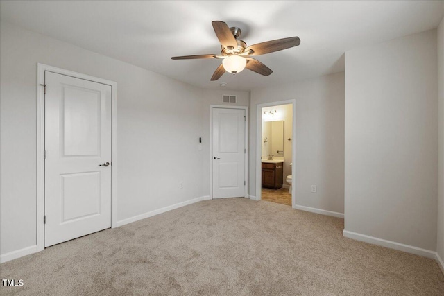 1704 Fawn Chase Ct, Wake Forest, NC 27587 - unfurnished bedroom with light carpet, baseboards, ensuite bathroom, and ceiling fan