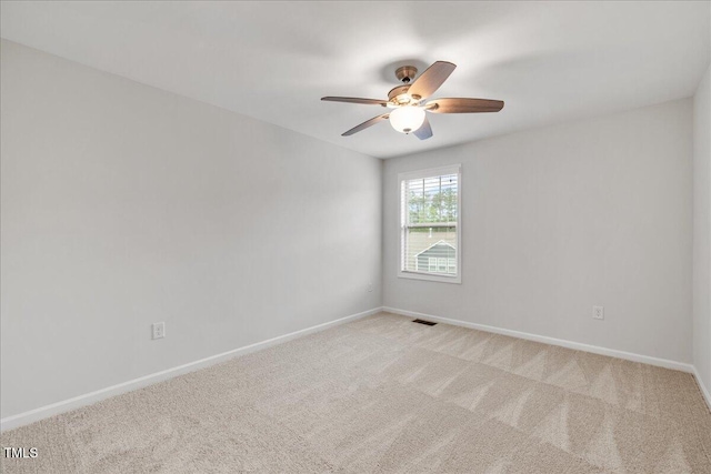 1704 Fawn Chase Ct, Wake Forest, NC 27587 - unfurnished room featuring light carpet, a ceiling fan, and baseboards