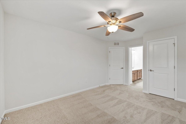 1704 Fawn Chase Ct, Wake Forest, NC 27587 - unfurnished bedroom with light carpet, baseboards, ensuite bathroom, and ceiling fan