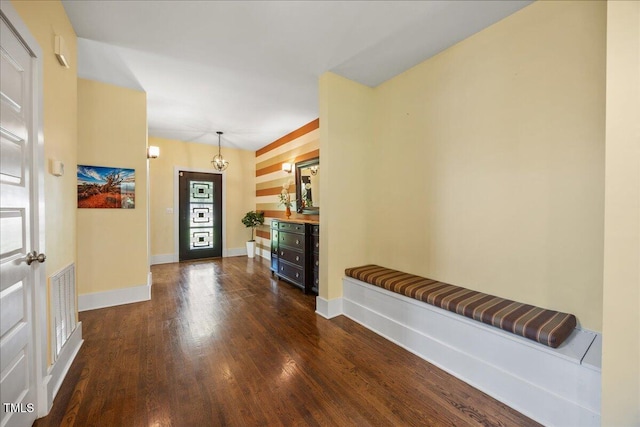 12636 Old Creedmoor Rd, Raleigh, NC 27613 - foyer entrance with wood finished floors, baseboards, and a chandelier