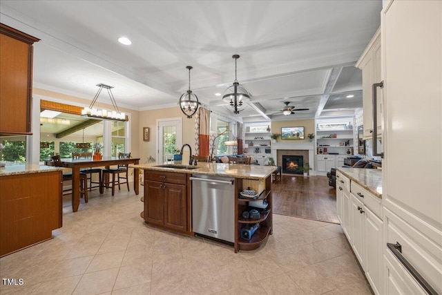 12636 Old Creedmoor Rd, Raleigh, NC 27613 - kitchen featuring dishwasher, a sink, a glass covered fireplace, a chandelier, and ceiling fan