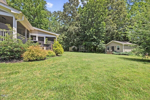 12636 Old Creedmoor Rd, Raleigh, NC 27613 - view of green lawn featuring a sunroom and view of wooded area