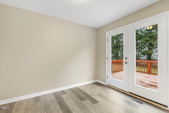 366 E Smithfield St, Angier, NC 27501 - unfurnished room featuring wood finished floors, baseboards, and french doors