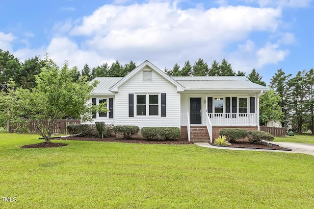 366 E Smithfield St, Angier, NC 27501 - ranch-style house featuring metal roof and covered porch