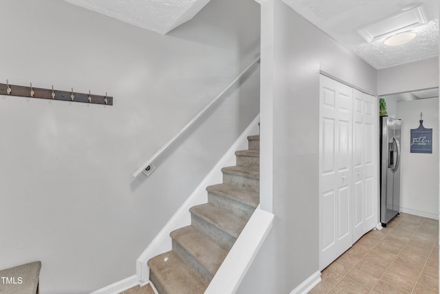 8361 Mcguire Dr, Raleigh, NC 27616 - stairway with a textured ceiling
