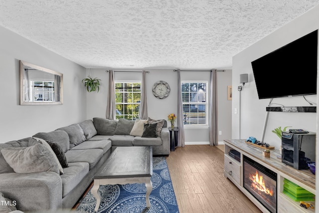 8361 Mcguire Dr, Raleigh, NC 27616 - living area featuring light wood-style floors and a textured ceiling