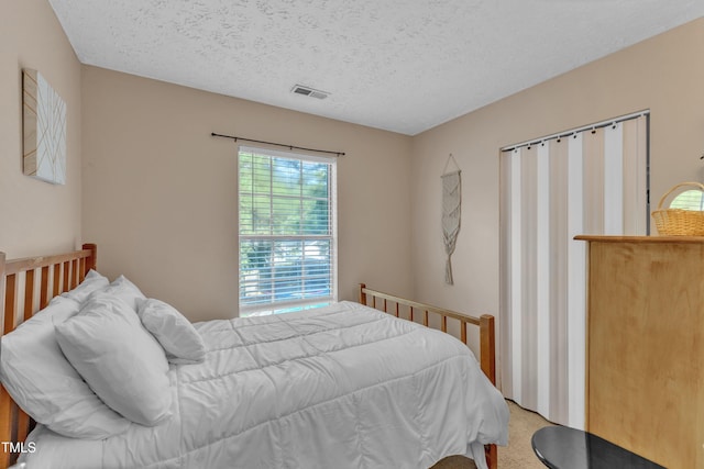 8361 Mcguire Dr, Raleigh, NC 27616 - bedroom featuring a textured ceiling