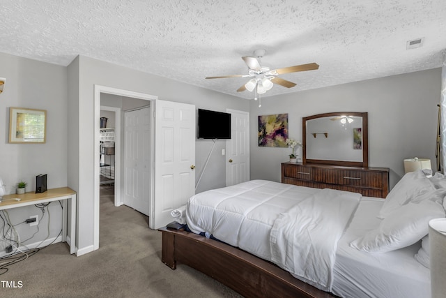 8361 Mcguire Dr, Raleigh, NC 27616 - carpeted bedroom featuring a textured ceiling and a ceiling fan