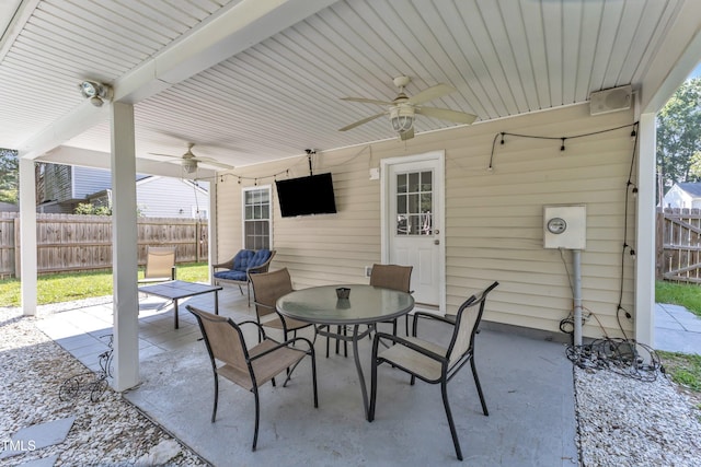 8361 Mcguire Dr, Raleigh, NC 27616 - fenced backyard featuring a ceiling fan, a patio area, and outdoor dining space