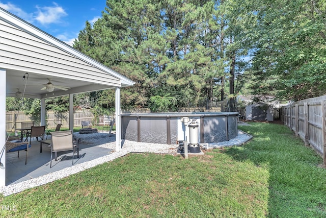 8361 Mcguire Dr, Raleigh, NC 27616 - fenced backyard featuring an outdoor fire pit, a ceiling fan, and a patio area