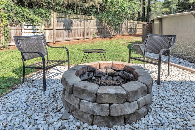 8361 Mcguire Dr, Raleigh, NC 27616 - fenced backyard with an outdoor fire pit and a patio area