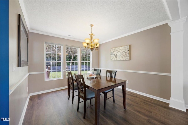 4805 Castle Crest Ct, Raleigh, NC 27616 - dining space featuring a chandelier, a textured ceiling, dark wood-type flooring, crown molding, and ornate columns