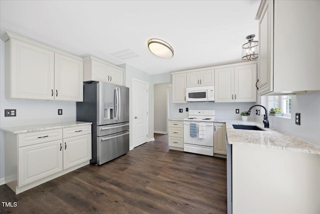 4805 Castle Crest Ct, Raleigh, NC 27616 - kitchen featuring white appliances, a sink, dark wood finished floors, and white cabinetry