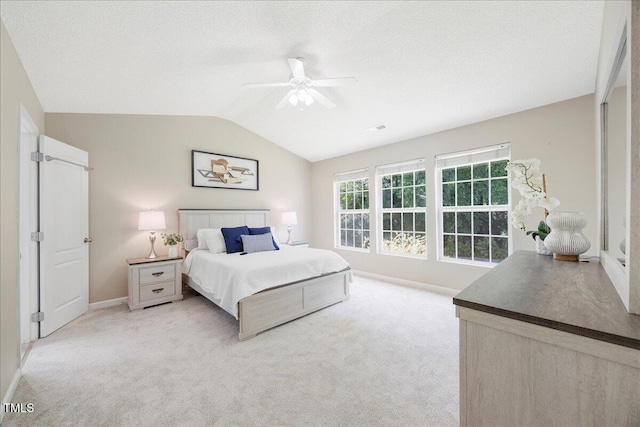 4805 Castle Crest Ct, Raleigh, NC 27616 - bedroom featuring vaulted ceiling, baseboards, light carpet, a ceiling fan, and a textured ceiling