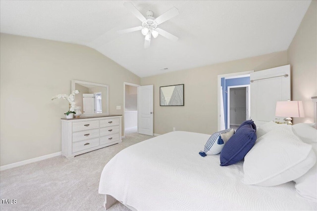 4805 Castle Crest Ct, Raleigh, NC 27616 - bedroom with vaulted ceiling, light carpet, a walk in closet, baseboards, and a ceiling fan