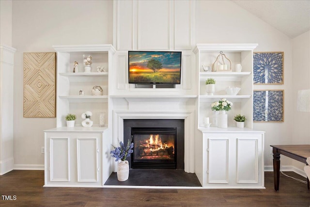 4805 Castle Crest Ct, Raleigh, NC 27616 - detailed view of wood finished floors, a warm lit fireplace, and baseboards