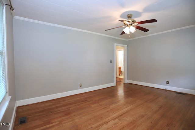 2006 N Ashland Dr, Burlington, NC 27217 - empty room with wood finished floors, ceiling fan, baseboards, and crown molding