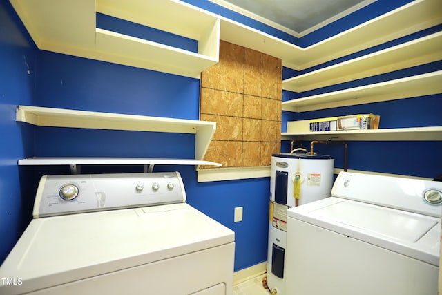2006 N Ashland Dr, Burlington, NC 27217 - washroom featuring electric water heater, washing machine and dryer, and baseboards