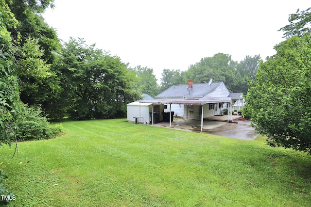 2006 N Ashland Dr, Burlington, NC 27217 - view of green lawn with a carport