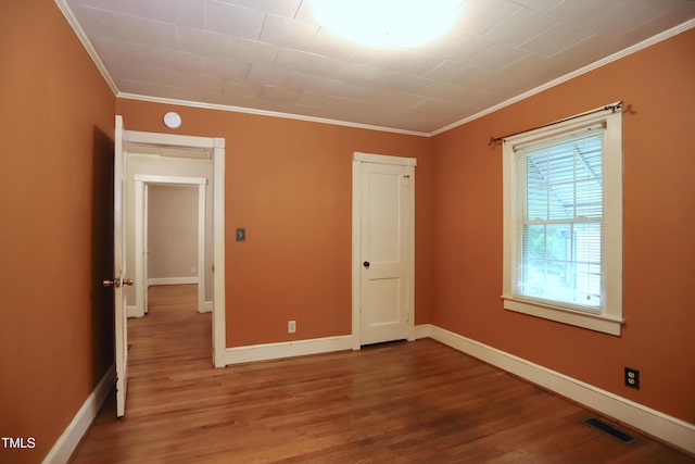 2006 N Ashland Dr, Burlington, NC 27217 - unfurnished room with crown molding, wood finished floors, and baseboards
