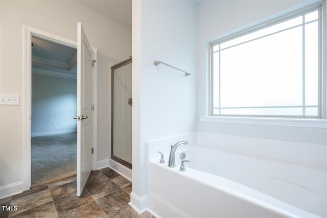 120 Newport Lndg Unit 99, Garner, NC 27529 - full bathroom with a bath, a shower stall, baseboards, and stone finish floors