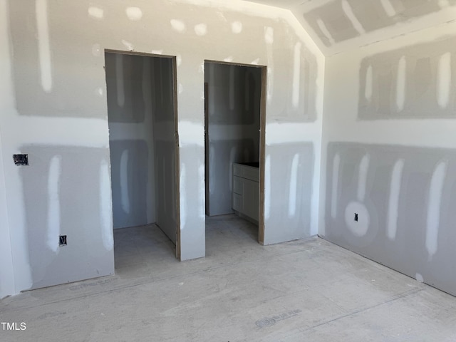 163 Batten Hill Ln, Selma, NC 27576 - unfurnished bedroom featuring vaulted ceiling