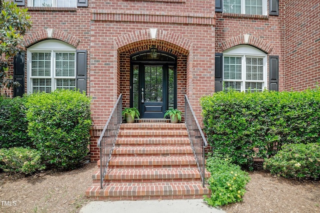 225 Norwalk St, Holly Springs, NC 27540 - doorway to property featuring brick siding