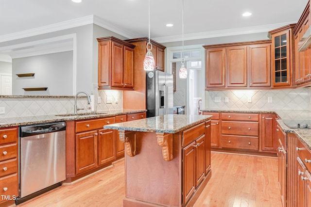 225 Norwalk St, Holly Springs, NC 27540 - kitchen featuring stainless steel appliances, a sink, light wood finished floors, decorative backsplash, and crown molding