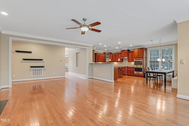 225 Norwalk St, Holly Springs, NC 27540 - unfurnished living room with crown molding, a ceiling fan, recessed lighting, baseboards, and light wood-style flooring