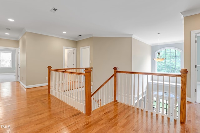 225 Norwalk St, Holly Springs, NC 27540 - corridor with an upstairs landing, wood finished floors, recessed lighting, baseboards, and ornamental molding