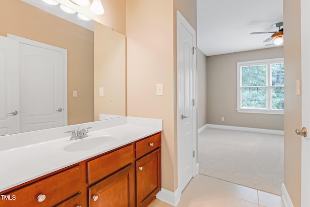225 Norwalk St, Holly Springs, NC 27540 - bathroom with vanity, baseboards, and a ceiling fan