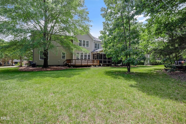 225 Norwalk St, Holly Springs, NC 27540 - view of green lawn featuring a wooden deck and a sunroom