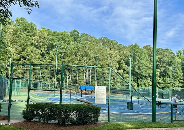 200 Greensview Dr, Cary, NC 27518 - view of tennis court with a view of trees