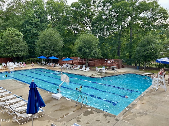 200 Greensview Dr, Cary, NC 27518 - community pool with a patio area and view of wooded area