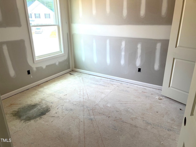 21 Windflower Ct Unit 11, Clayton, NC 27520 - spare room with baseboards