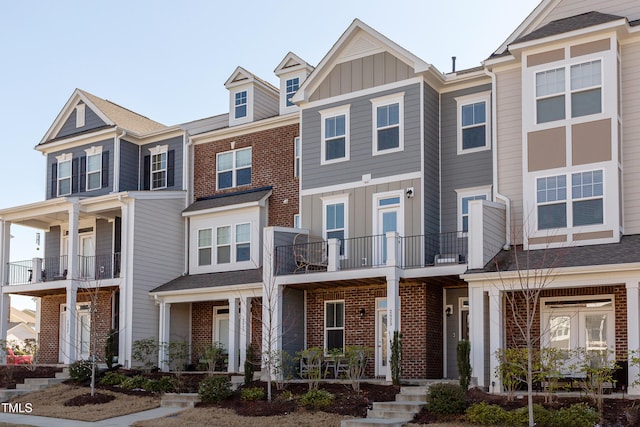 2929 Great Lawn Rd, Apex, NC 27502 - townhome / multi-family property with brick siding, board and batten siding, and a balcony