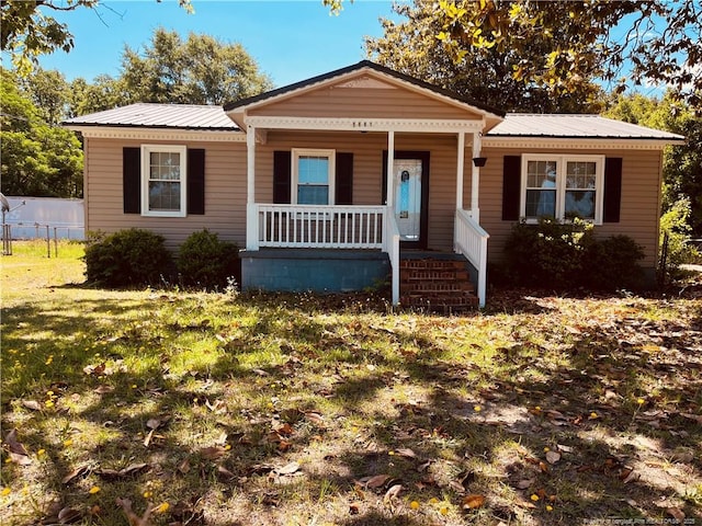 9881 Mccoll Rd, Laurinburg, NC 28352 - bungalow-style home with metal roof and a porch