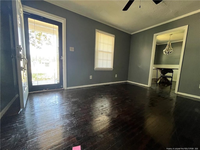 9881 Mccoll Rd, Laurinburg, NC 28352 - foyer featuring hardwood / wood-style floors, ornamental molding, healthy amount of natural light, a ceiling fan, and baseboards