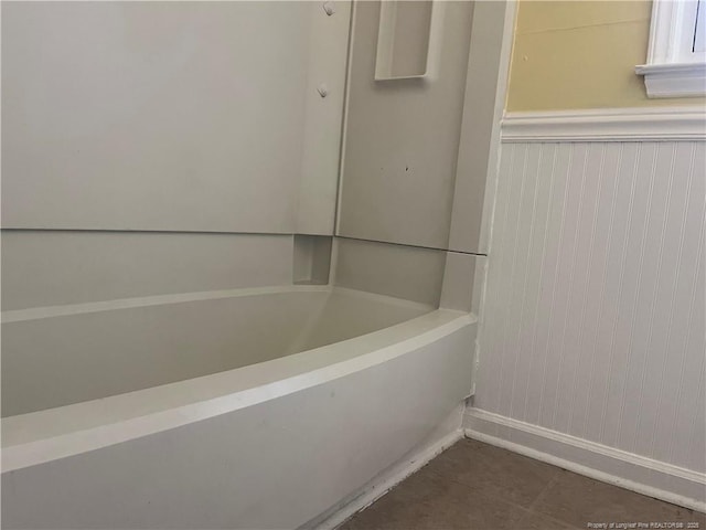 9881 Mccoll Rd, Laurinburg, NC 28352 - full bathroom featuring baseboards, a bath, and tile patterned flooring
