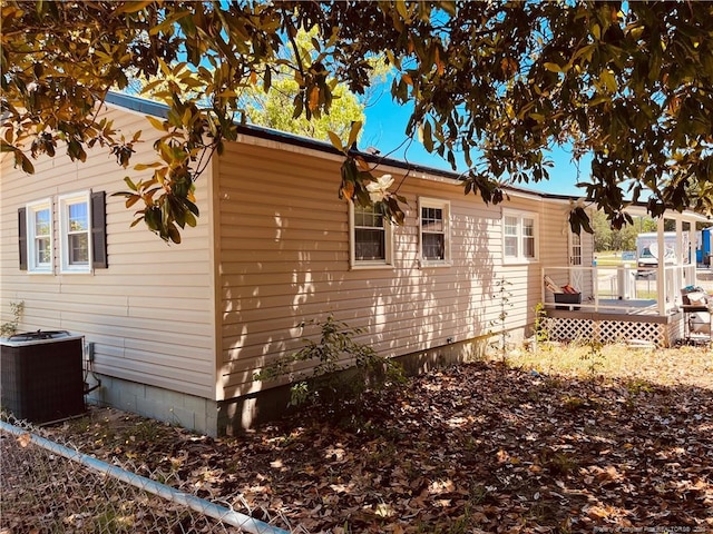 9881 Mccoll Rd, Laurinburg, NC 28352 - view of side of property with cooling unit and a deck