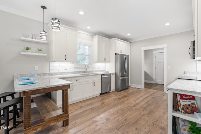1004 Snow Peak Ct, Raleigh, NC 27603 - kitchen featuring stainless steel appliances, open shelves, white cabinets, recessed lighting, and ornamental molding