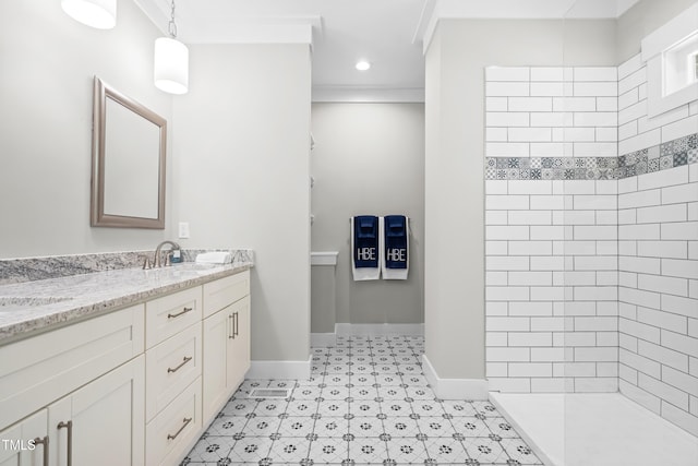 1004 Snow Peak Ct, Raleigh, NC 27603 - bathroom featuring double vanity, tiled shower, ornamental molding, and tile patterned floors
