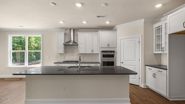 194 Gilmer St, Fuquay Varina, NC 27526 - kitchen featuring wall chimney exhaust hood, a sink, double oven, dark countertops, and ornamental molding