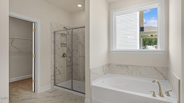194 Gilmer St, Fuquay Varina, NC 27526 - full bathroom featuring a bath, a marble finish shower, marble finish floors, a spacious closet, and baseboards