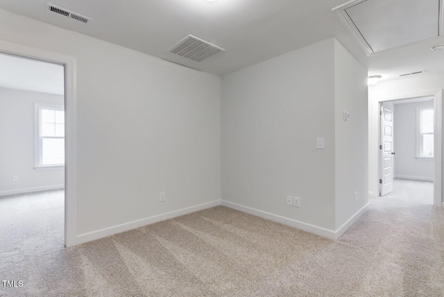 2309 Redbridge Ln, Apex, NC 27502 - spare room with attic access, carpet flooring, and baseboards