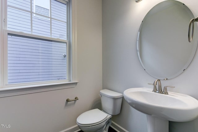2309 Redbridge Ln, Apex, NC 27502 - bathroom with baseboards, toilet, and a sink