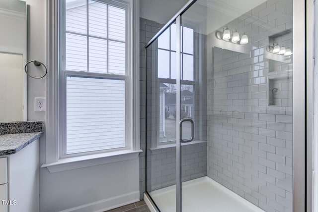 2309 Redbridge Ln, Apex, NC 27502 - full bathroom featuring crown molding, a stall shower, vanity, and baseboards