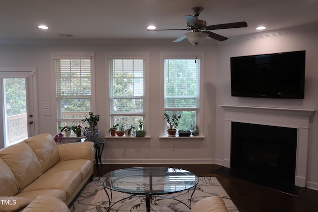 2309 Redbridge Ln, Apex, NC 27502 - living room featuring recessed lighting, crown molding, healthy amount of natural light, wood finished floors, and baseboards